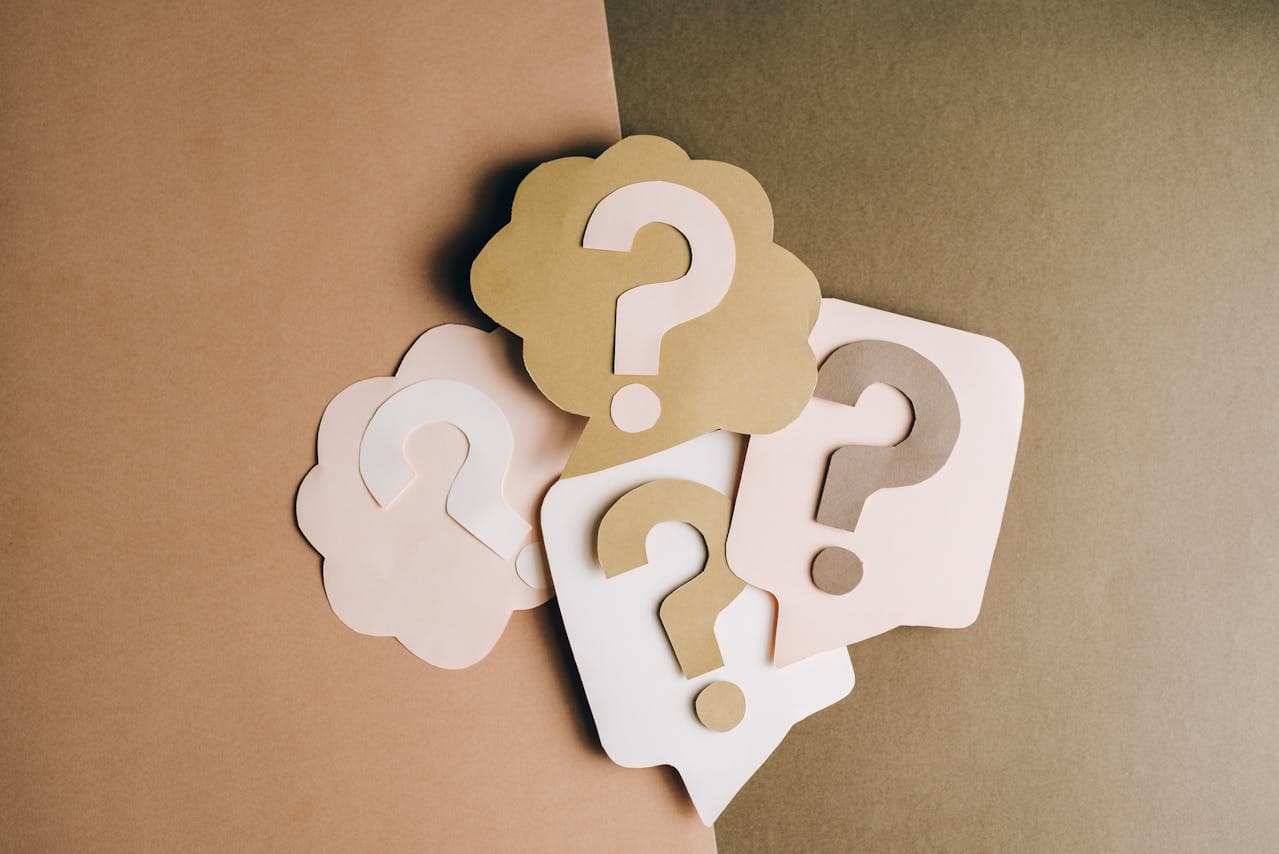 Person holding a question mark sign
